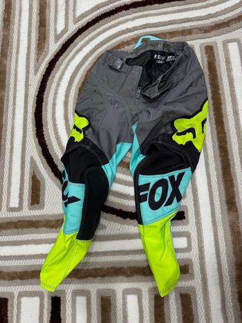 Pantalon motocross Fox Racing 180 taille 22Y bleu/gris/jaune fluo très bon état