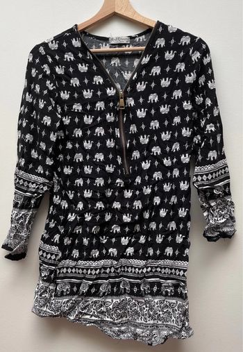 Blouse manches longues noire avec motifs éléphants blancs
