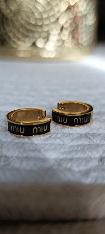 Boucles d oreilles miu miu