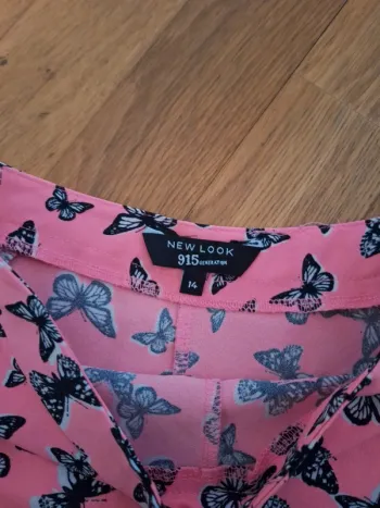 Short rose motif papillon taille 14ans