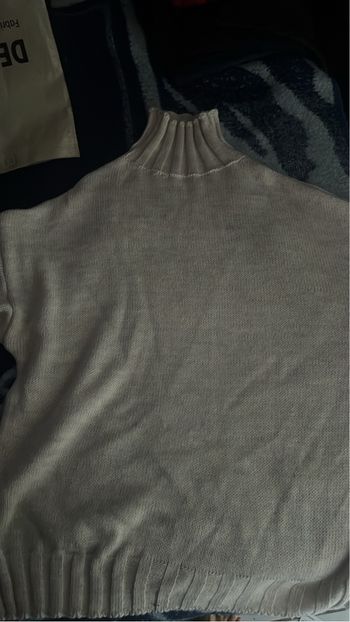 Pull beige col roulé