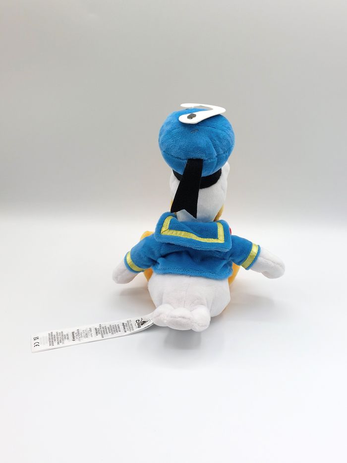Peluche doudou Donald Duck DISNEYLAND Disneystore noeud rouge 30 cm comme neuf - photo numéro 3