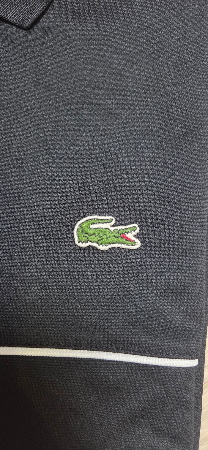 Polo Lacoste taille 5 / L noir et blanc Très bon état - photo numéro 3