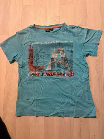 T-shirt by kool 10 ans bleu clair manches courtes bon etat