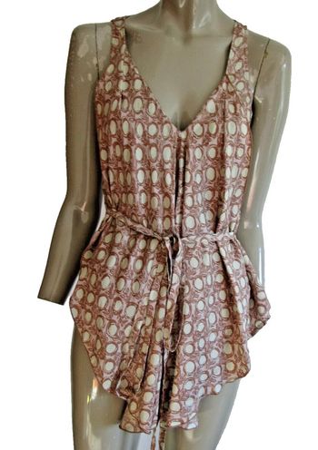 top tunique 100%soie marque manila grace pas de taille indiquée mais convient a une taille 36/38