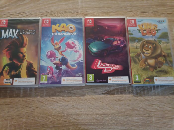 Console Nintendo Switch lite avec jeux et chargeur - photo numéro 3