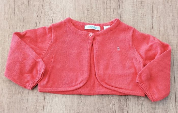Boléro fille rose corail foncé taille 6 mois Okaïdi