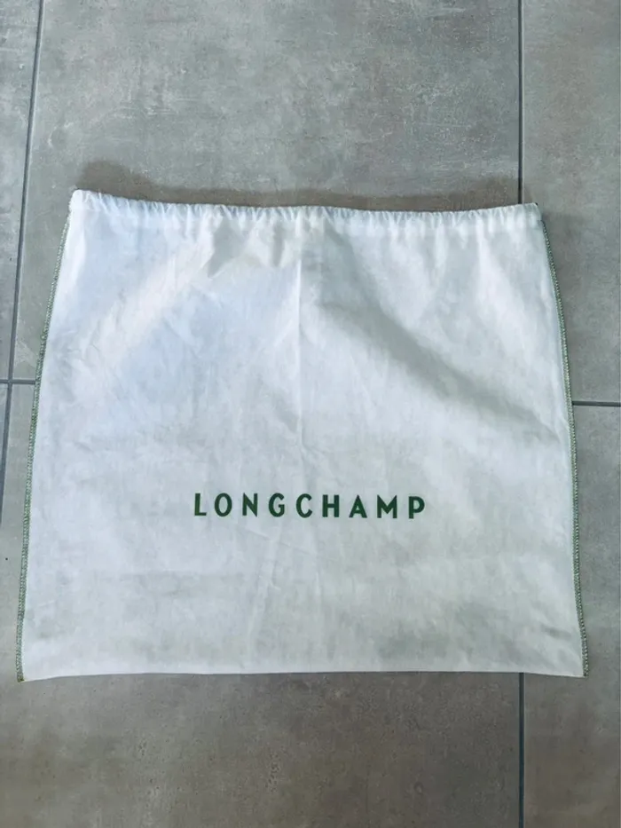 Grand dust bag Longchamp pour protéger sac neuf