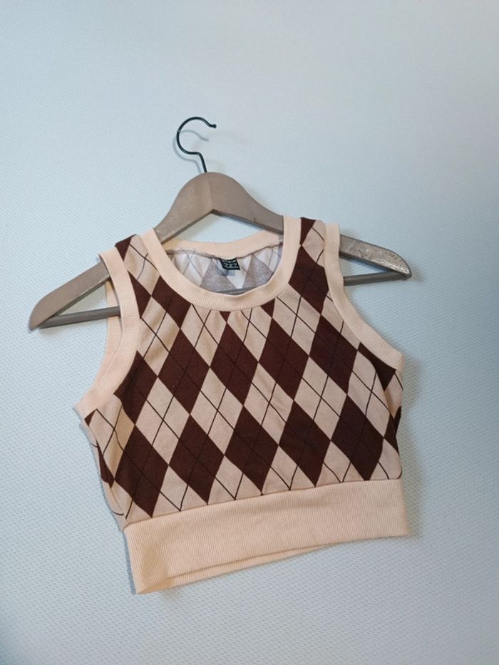 Petit pull sans manches à carreaux