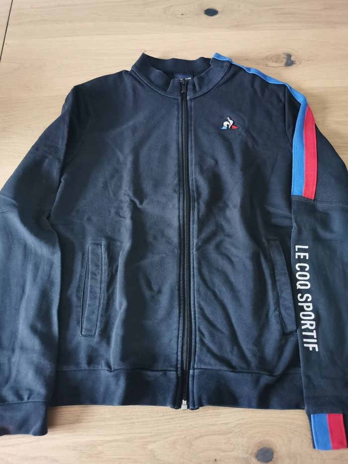 Gilet zippé noir sans capuche le coq sportif 14 ans en bon état