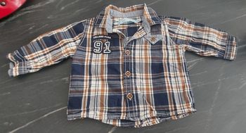 Chemise manche longue.