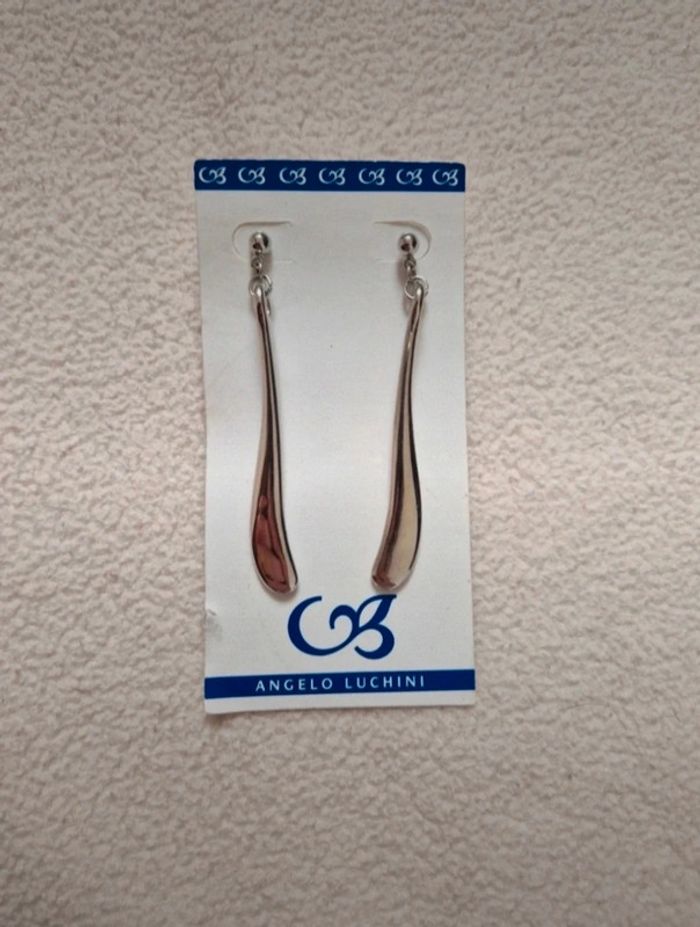 Neuf jolie paire de boucles d'oreilles pendente argenté