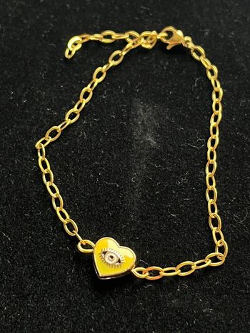 Bracelet doré acier inoxydable cœur œil jaune