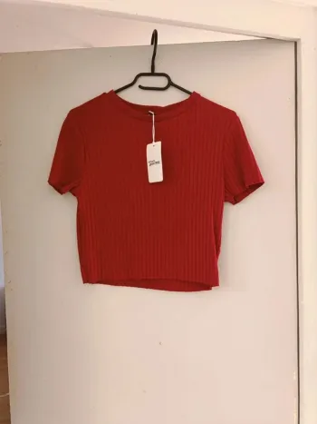 Petit top neuf taille L