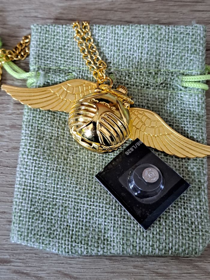 Montre pendentif Harry Potter Vif d' or vendue avec une pochette - photo numéro 2