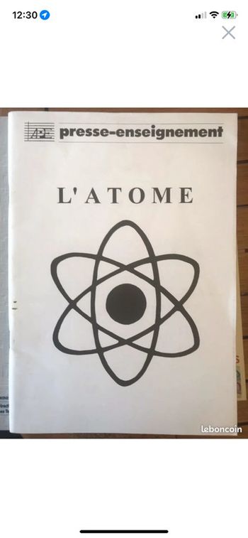 Presse enseignant l’atome