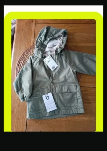 Manteau neuf 6 mois c&a