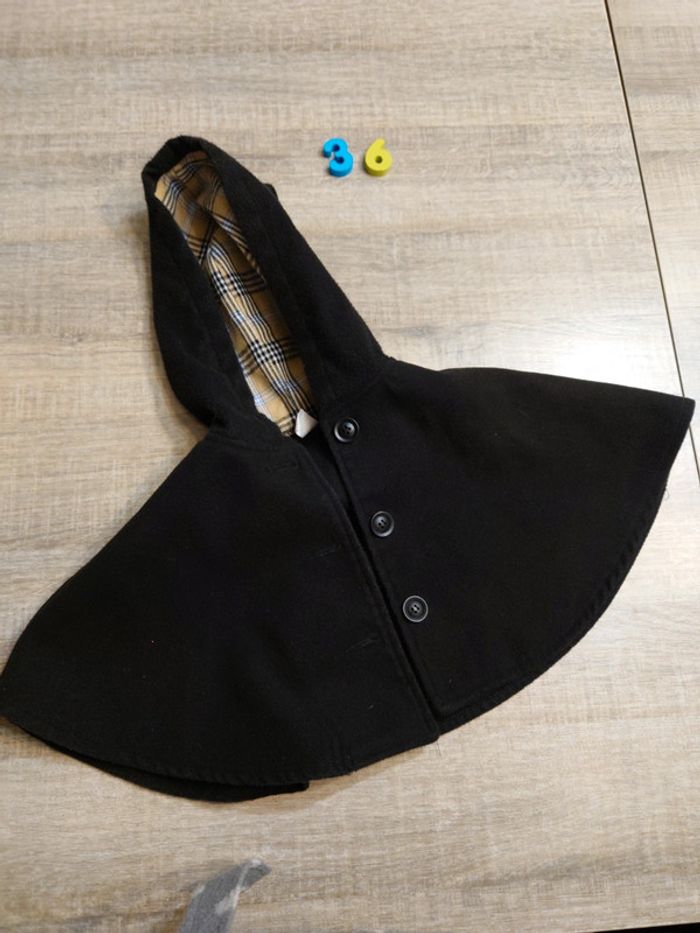 Poncho noir à capuche fille : 2 ans