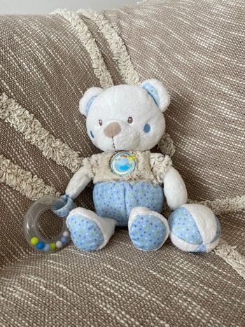 Peluche doudou d’éveil 25cm mots d’enfants ours blanc et bleu balle et anneaux à bille très bon état