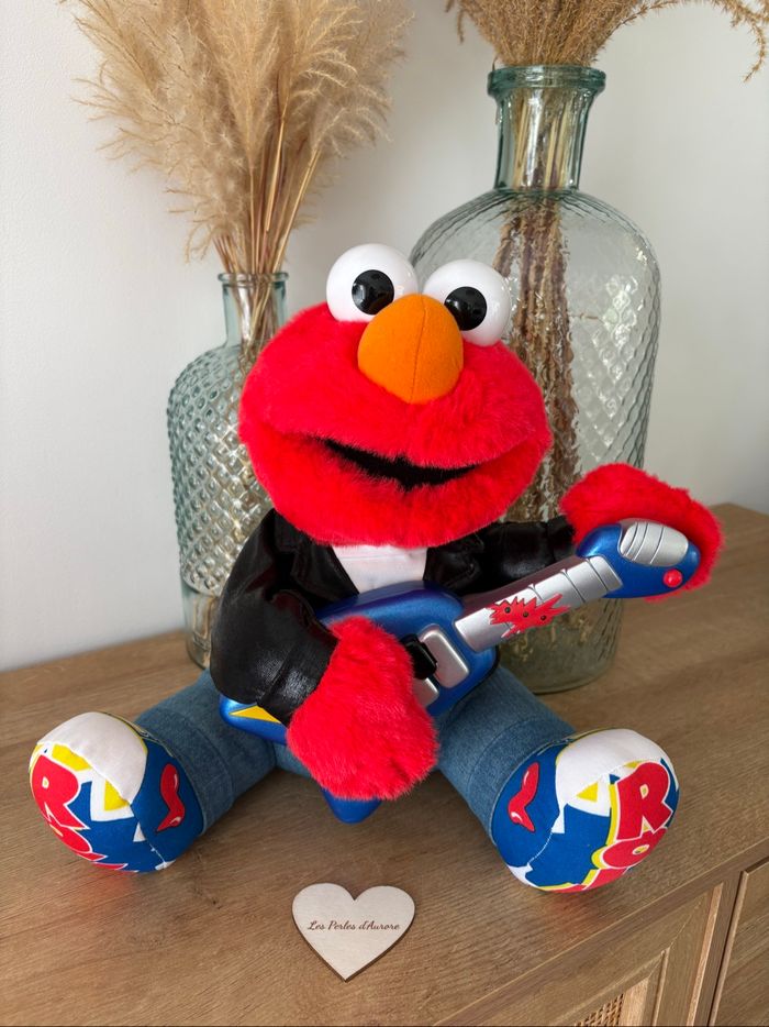 Peluche Elmo rock n roll musicale