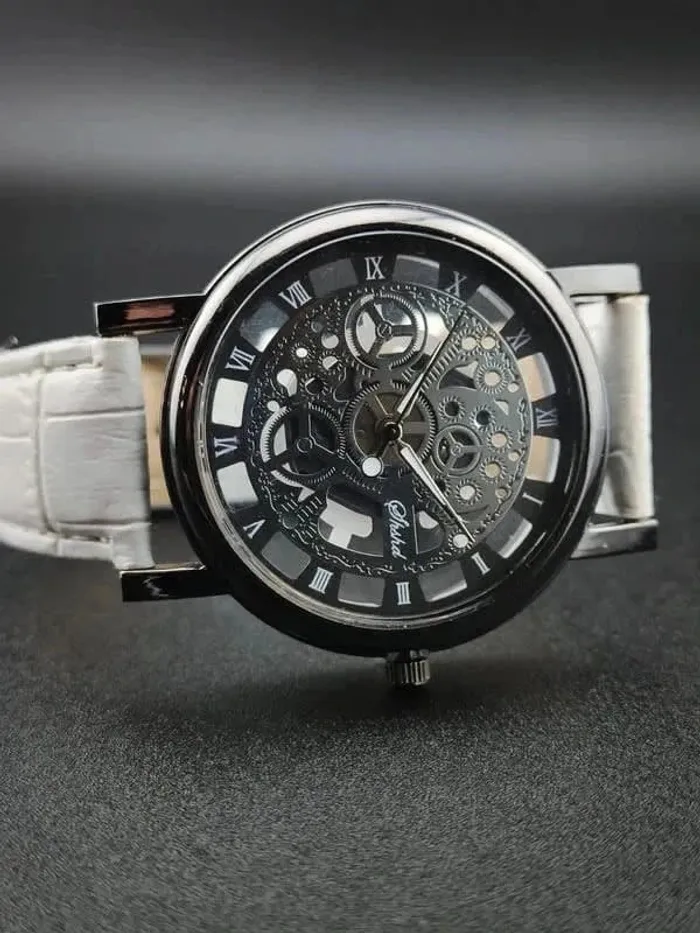 Montre blanche, mécanique argentée apparente - photo numéro 2