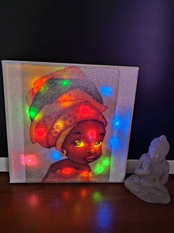 Cadre lumineux petite africaine