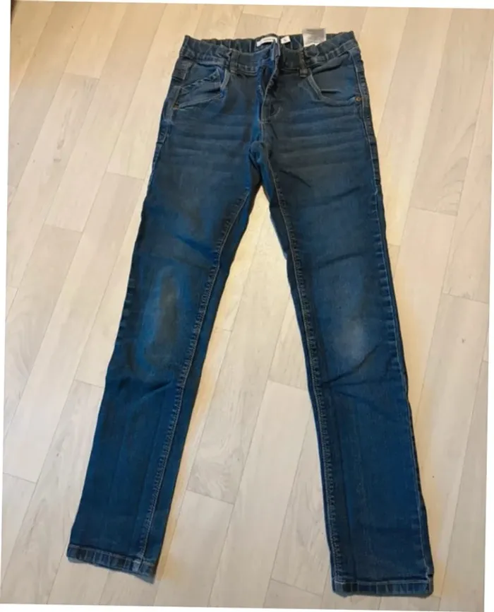 Jean bleu foncé slim 12 ans name it très bon état