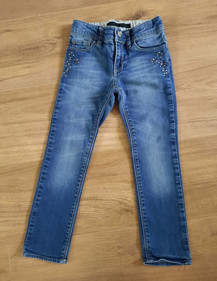 Jean bleu délavé fille coupe"slim" avec clous décoratifs IKKS 4 ans