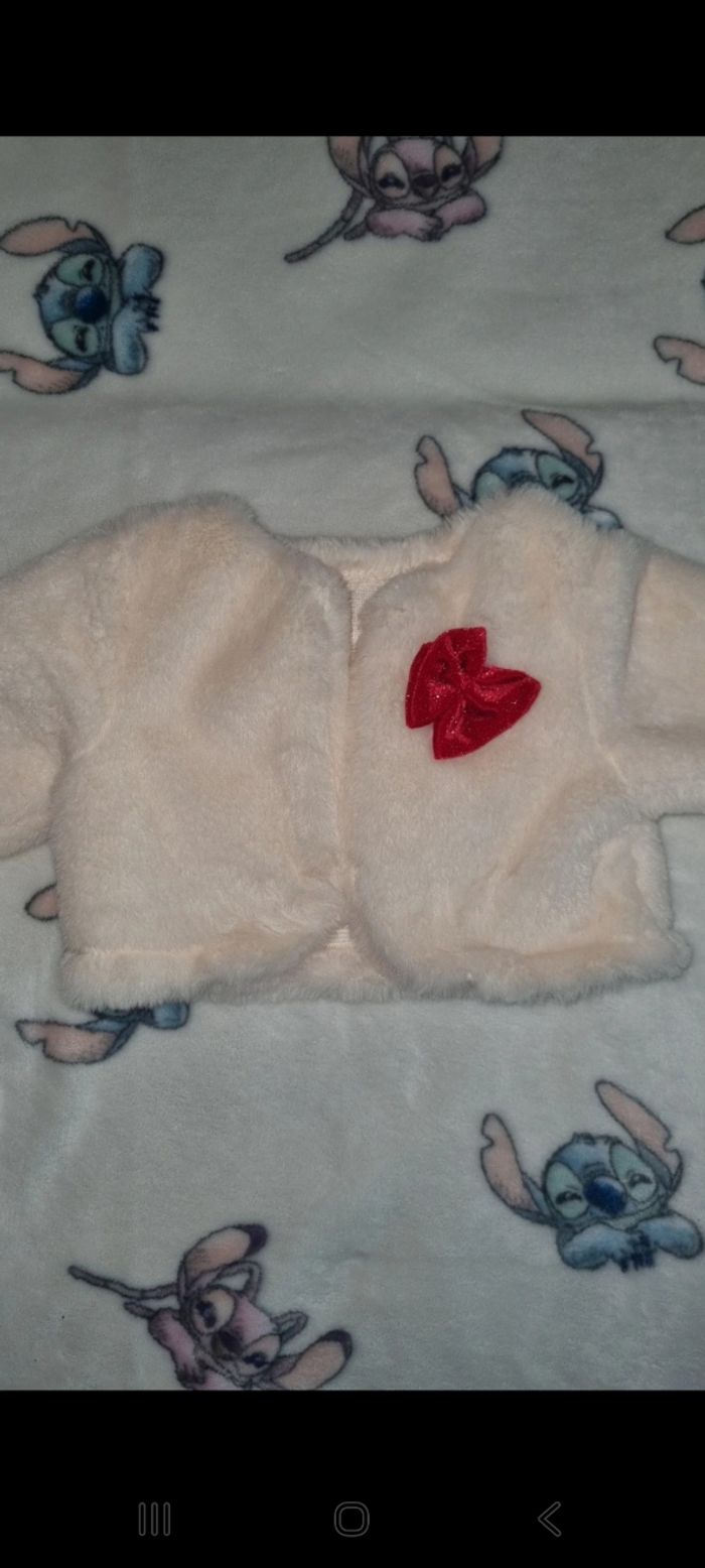 Gilet 6 mois en très bon état