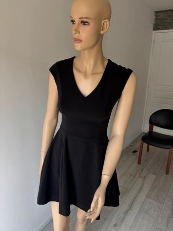 Robe peplum noir Philipp plein portée une soirée