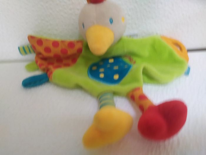 doudou oiseau explorer  '' baby sun '' rouge orange vert