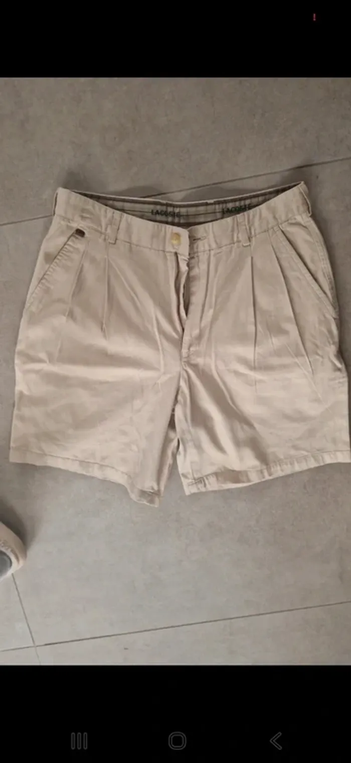 Beau short cargo vintage lacoste taille 42 /l tres bon eta