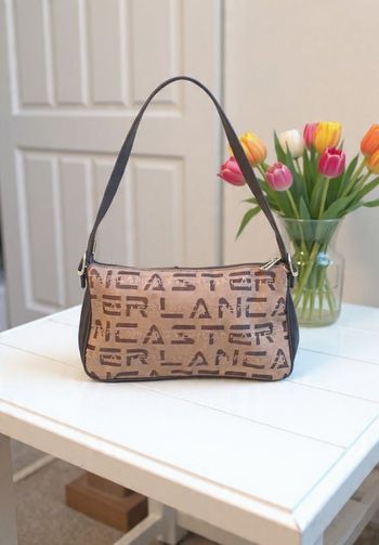 sac à mains marron marque Lancaster comme neuf monogramme toile et cuir