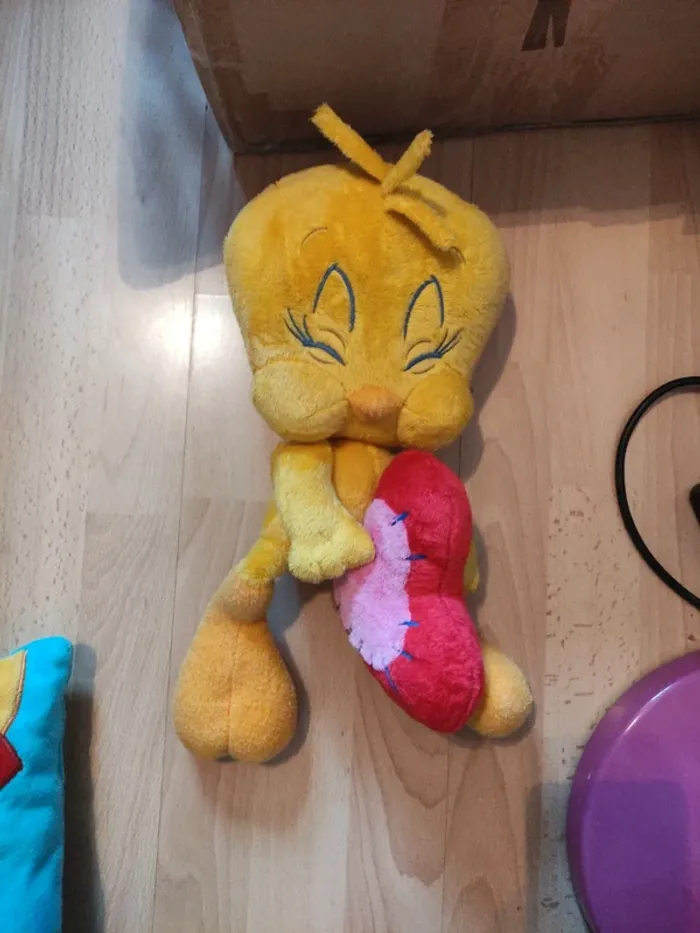 Très belle peluche titi en très bon état comme neuf