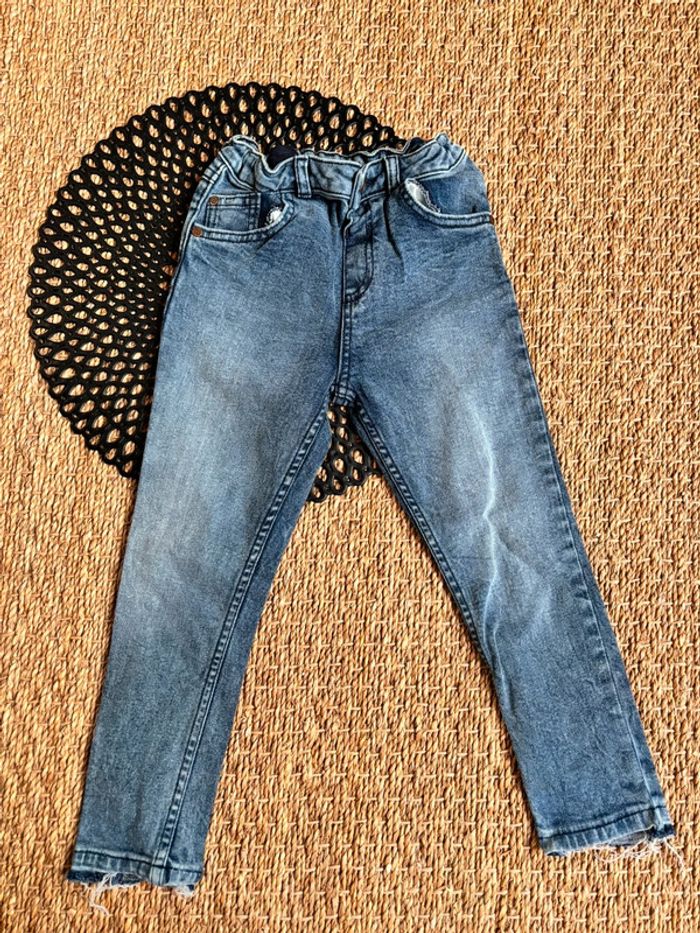 Jean acide bas effiloché