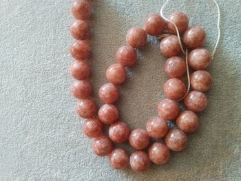 Collier / fil de perle en pierre du soleil 12 mm