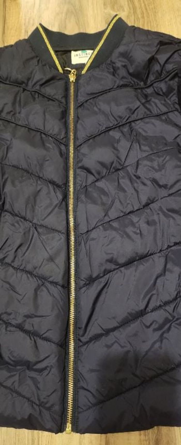 Doudoune avec motifs dorées