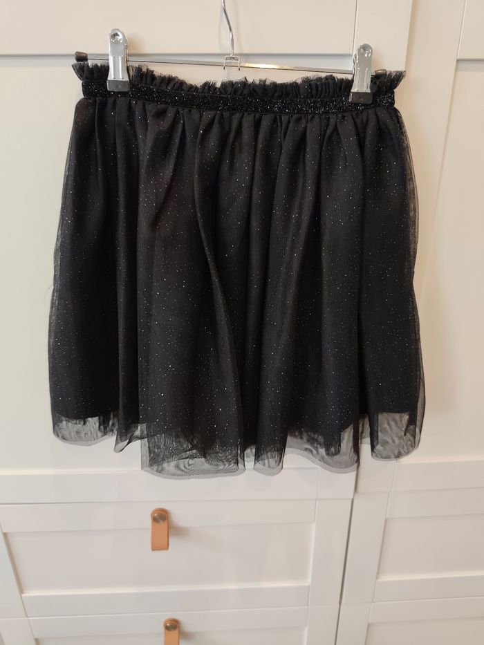 Jupe doublée a tulle argenté 10 12 ans