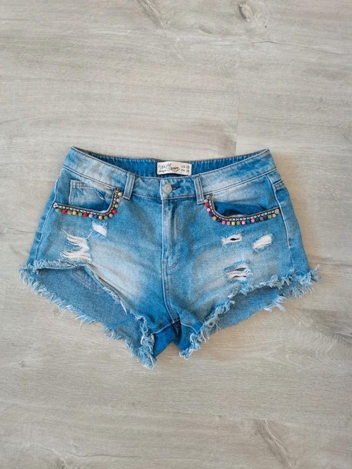 Short Jean denim délavé perles poches