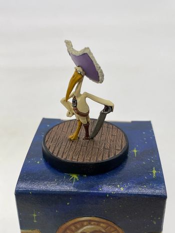 Figurine Cigognac de cape et de crocs