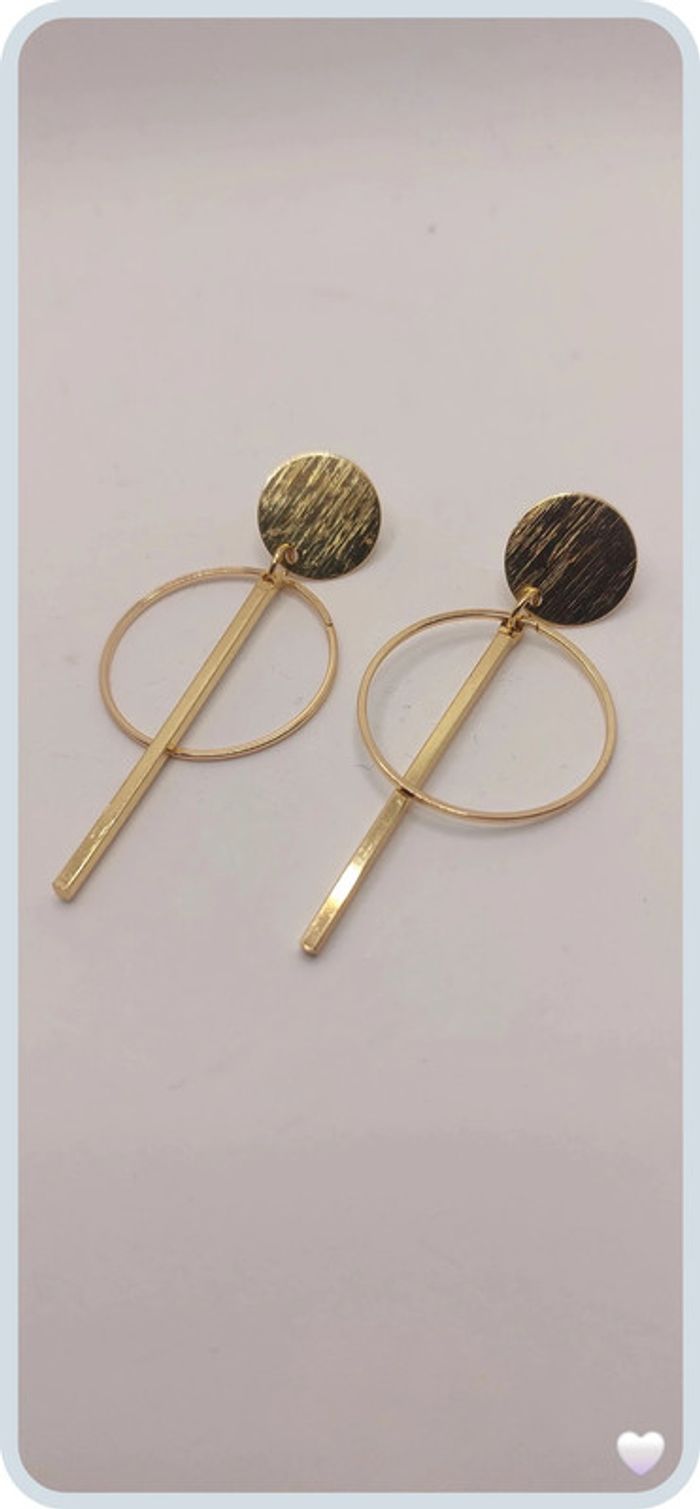 magnifique boucles d oreilles en acier dorée