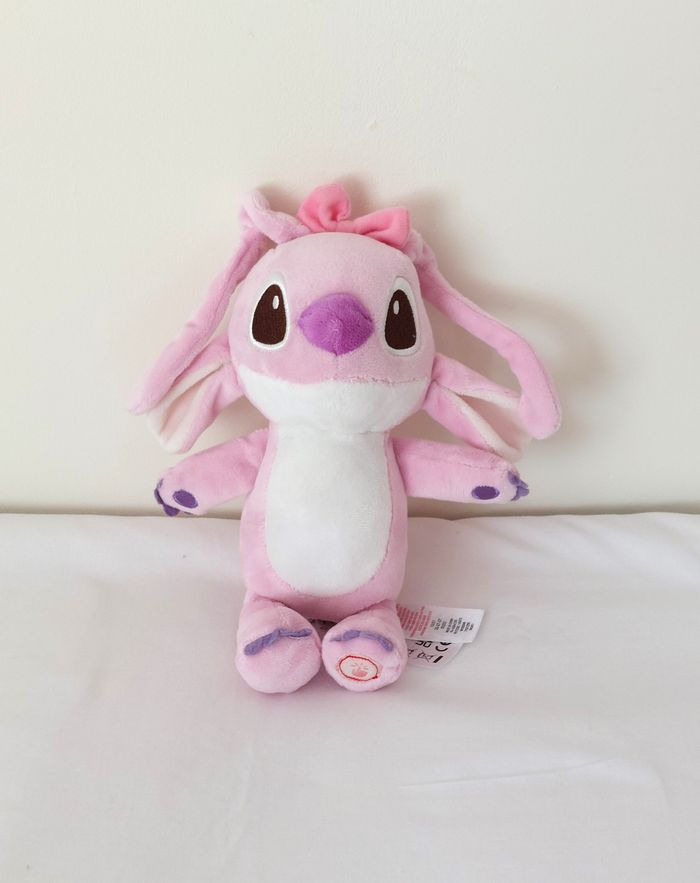 Peluche Angel rose blanc mauve Disney Primark lumineux sous les yeux 22 cm - photo numéro 2