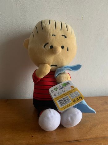 Peluche bébé avec bavoir Peanuts