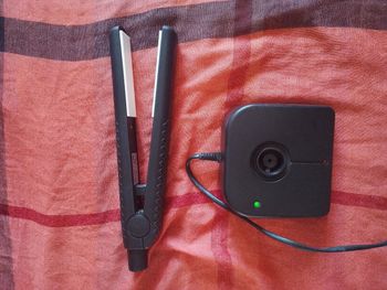 Lisseur sans fil avec son poste de recharge
