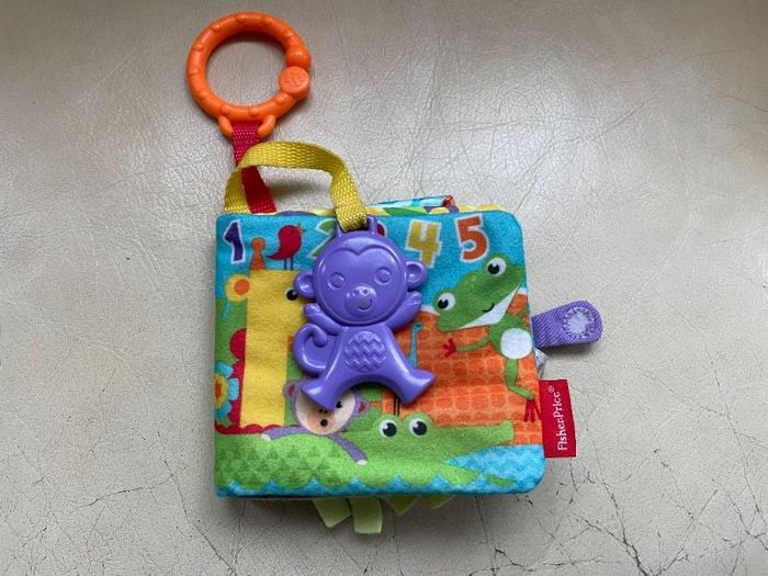 Livre d'activité en tissus avec jouet singe Fisher Price