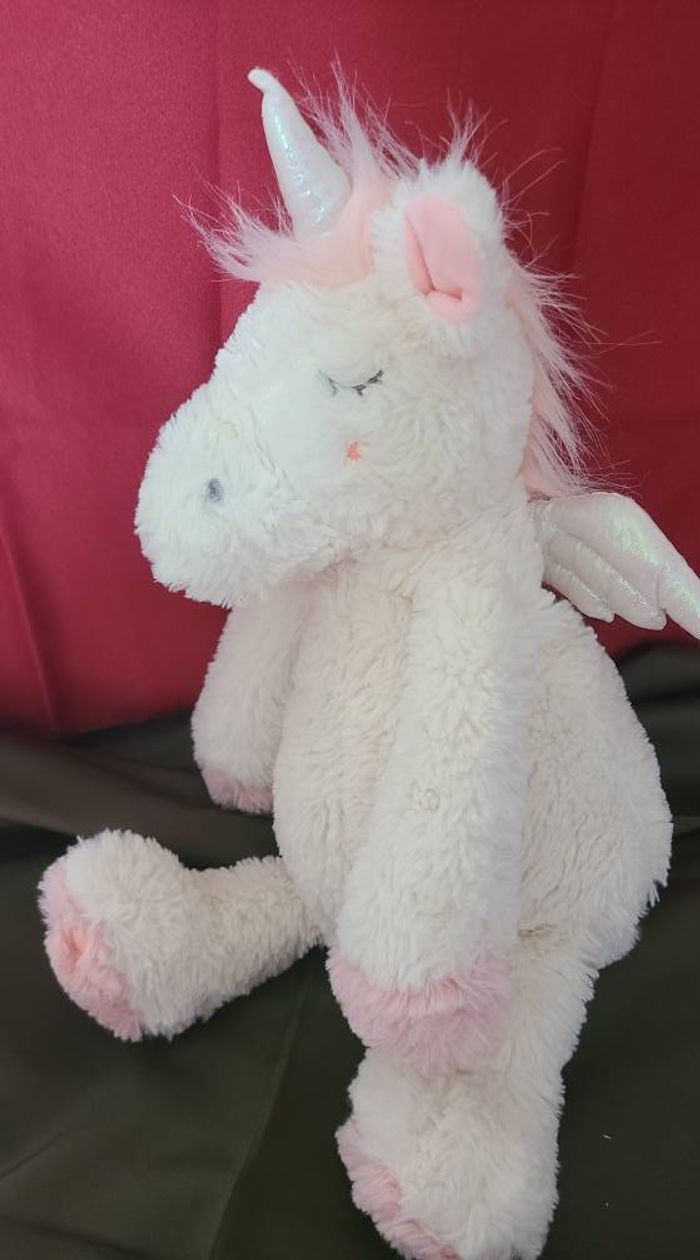 Peluche licorne ETAM range pyjama doudou bouillotte blanc rose ailes blanches 45 cm