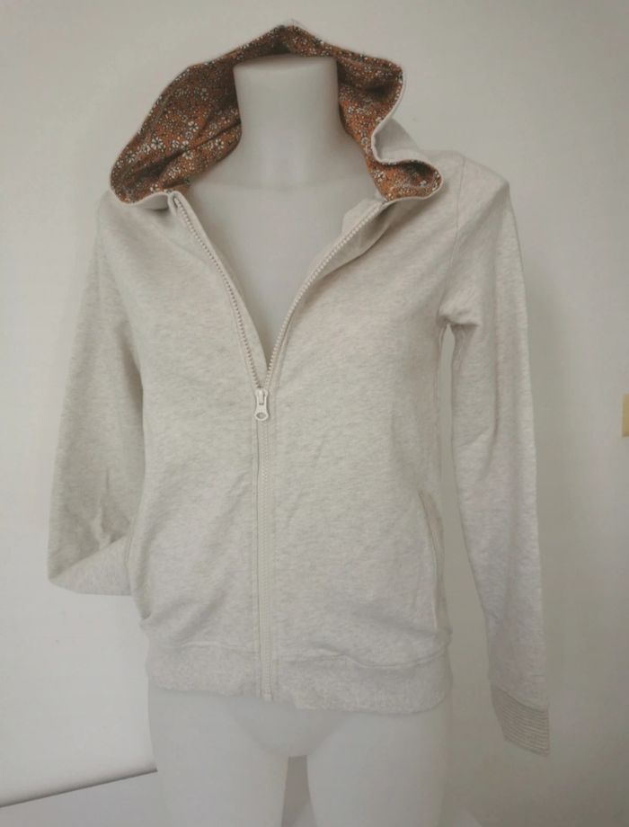 Gilet crème à capuche