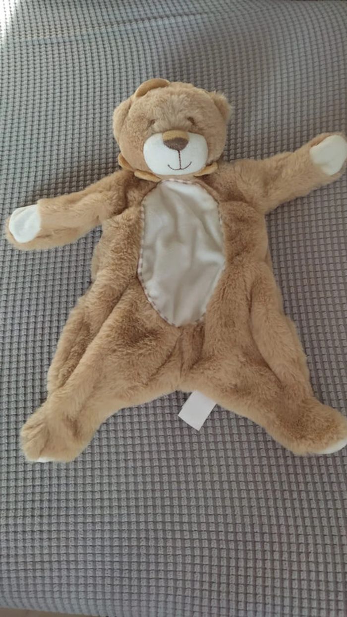 Doudou peluche Kellytoy bébé lion hochet