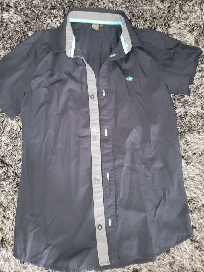 Chemise noire manches courtes kiabi 14 ans état neuf