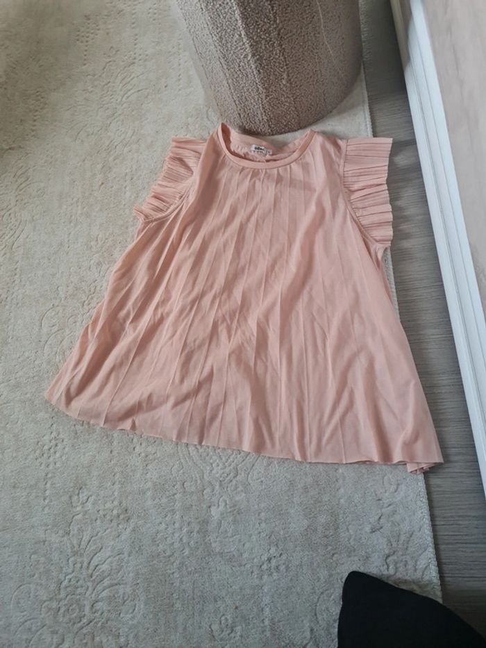 Haut gemo très bon etat taille l porté quelques fois